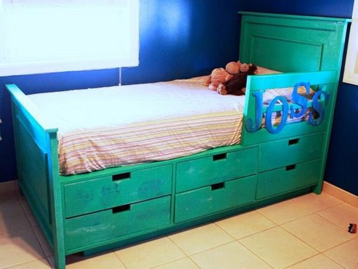 An image of a bed with side drawers. 