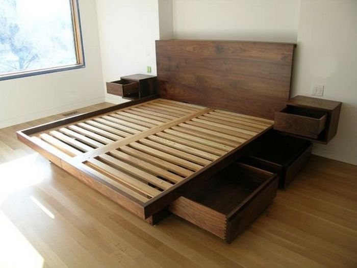 An image of a bed with side drawers. 