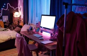 An image of a computer table for an article about bedroom tech layout.
