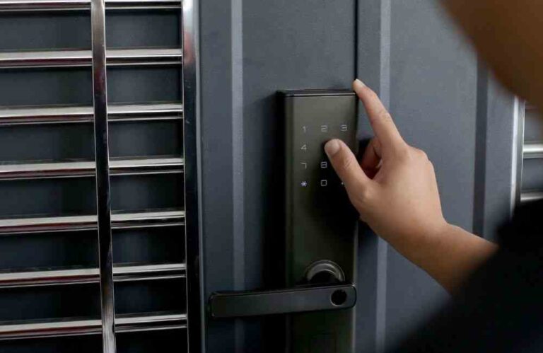 An image of a person opening a smart lock with numeric pads.