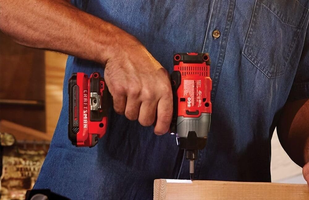 An image of a person using an impact driver for their projects.