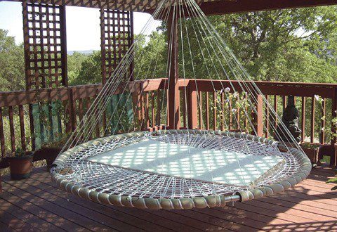 So, I'm seeing here an old trampoline base, some padding to cover the metal, either a custom canvas base or webbing created by rope weaving, and cushions... who is going to take the plunge and try this out? Maybe find an old trampoline at the local tip or recycling house?