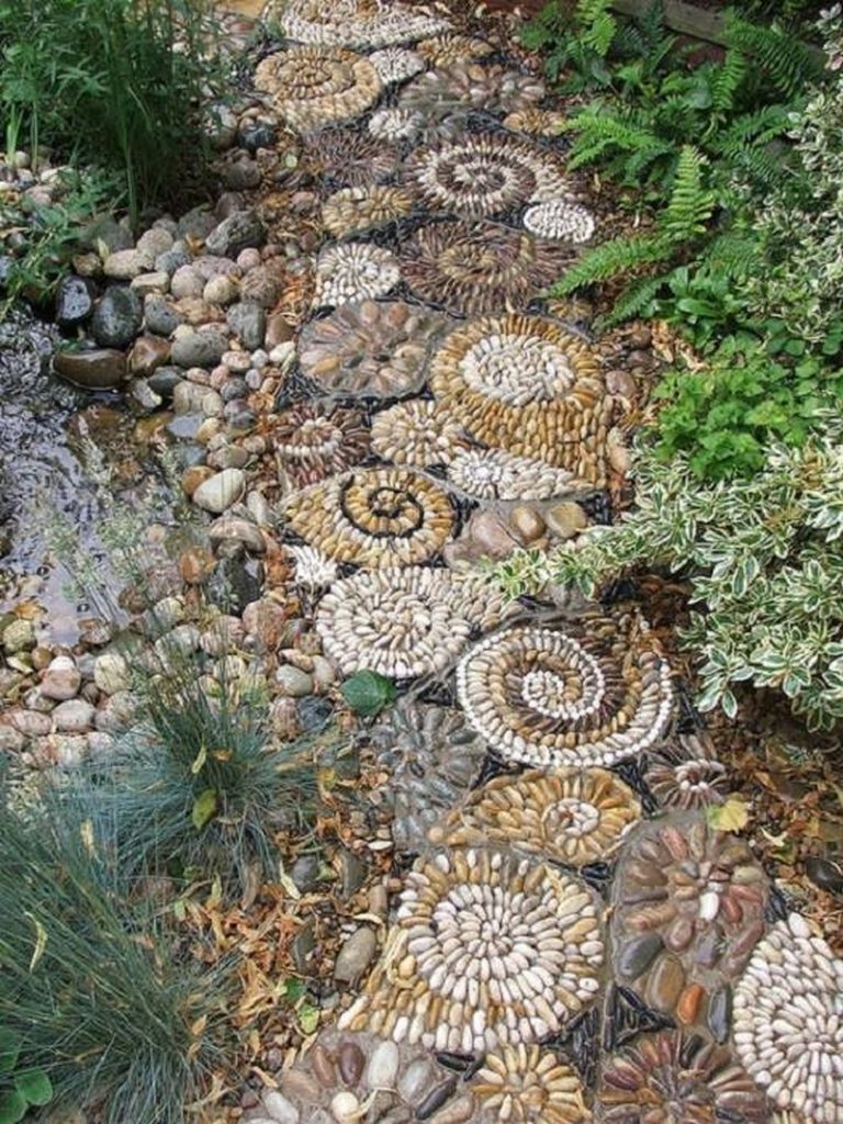 Here's another earthy toned mosaic garden path. All it takes is time and a little imagination.