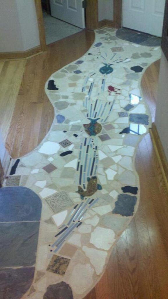 One of our fans - Clark Swindell - shared the mosaic he has installed in his renovated kitchen. We think it's great.