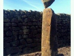 Stone balancing, 3 through stones from a drystone wall