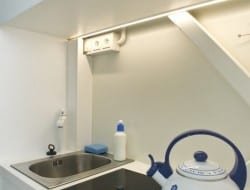 A fully functional kitchen in a hallway