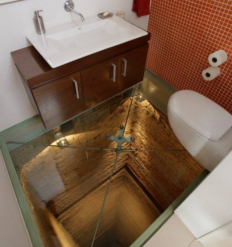 How's this for a long drop toilet? Built over an unused elevator shaft in a penthouse apartment, this "powder room" comes complete with a view of the 15 floor drop below thanks to the glass floor.