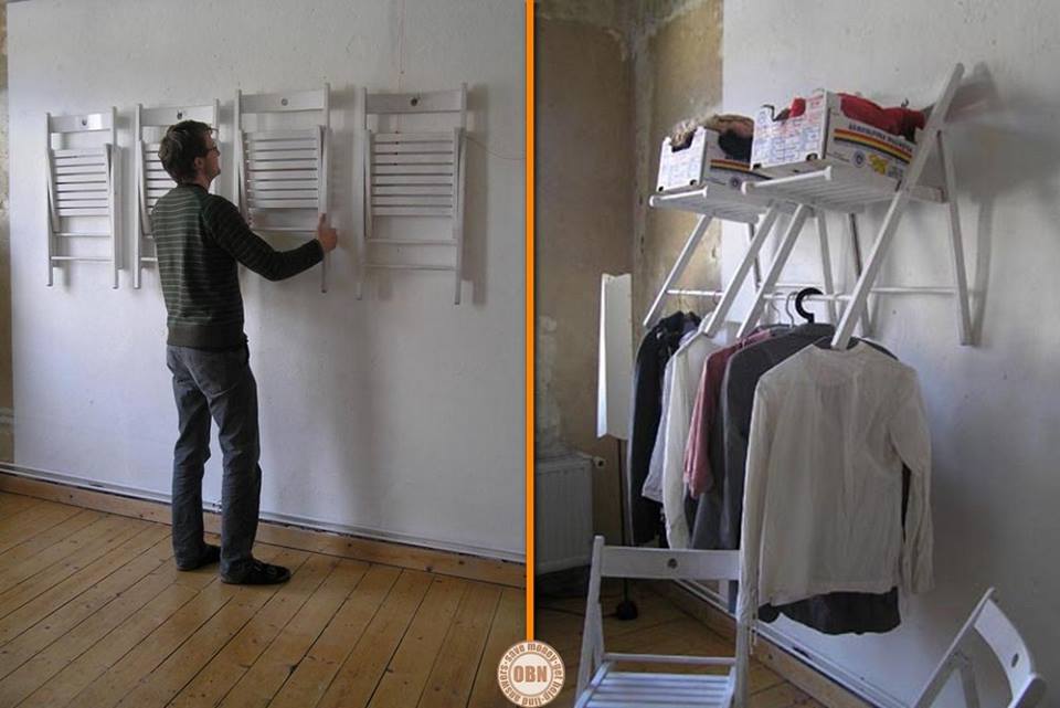 This is a great solution to create temporary or even permanent closet space. The bottom rod of the fold away chairs can be used for hanging clothing, and the seat for storage. You can easily fold them away when not in use.