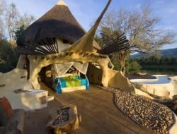 Can you think of anything NOT to love about this? Cob, fireplace, open bath, free-form pool, view... if this is glamping, put my name down as a permanent resident!