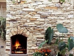 Another clever design using the dry stone building technique - this time incorporating a cozy outdoor fireplace into the garden wall.
