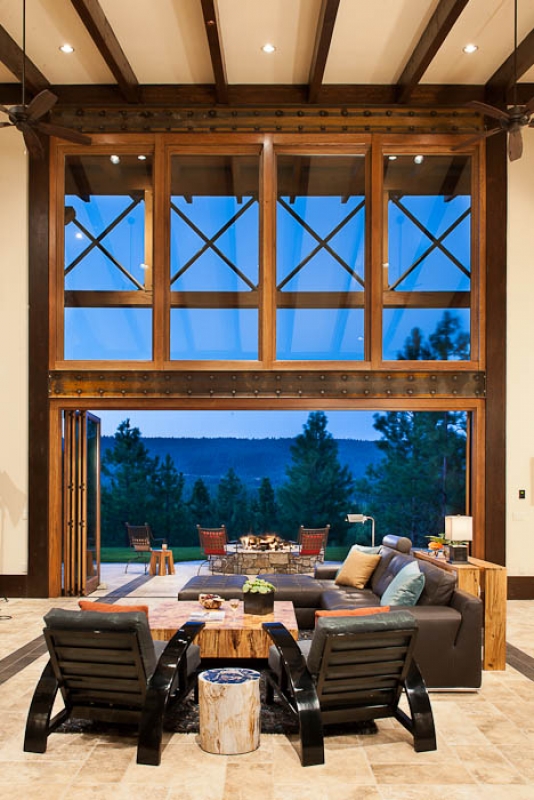 As a unique feature of the great room window wall, doors were included in the design so that they could fold back and away to create an uninterrupted flow indoors and out