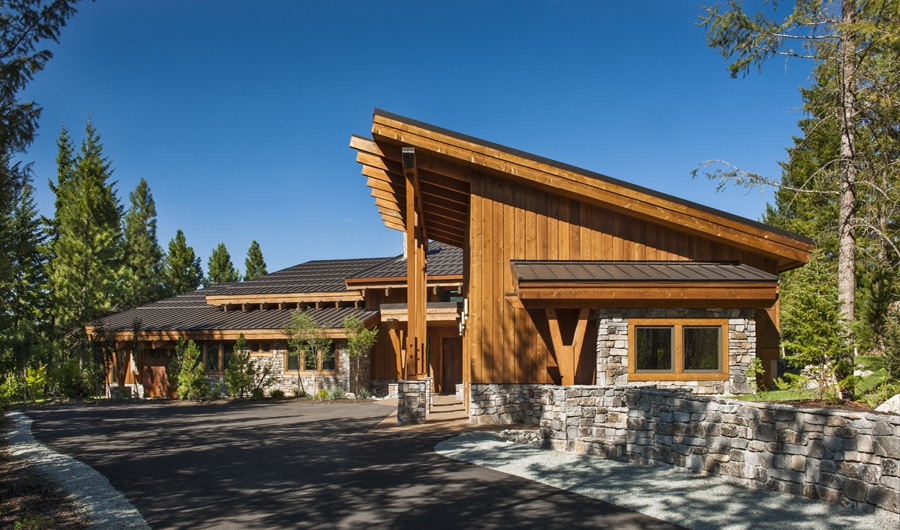 The side-view of this home shows the multiple roof-planes and angled pitches showcasing its new age design