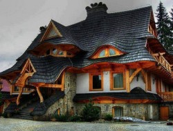 I don't know about you but this wonderful roof immediately evokes remembrances of fairy-tales. The home is in Zakopane Poland.