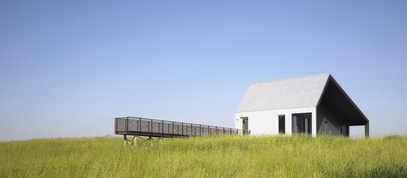 A house with an extended walkway for watching the splendid surroundings.