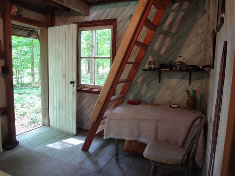 Whitewashed walls and gray floor