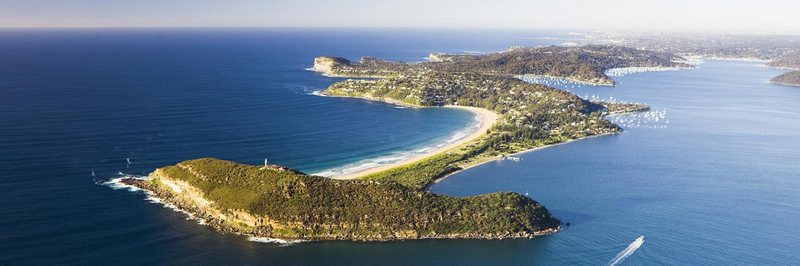 An aerial view over Barrenjoey Lighthouse and Palm Beach