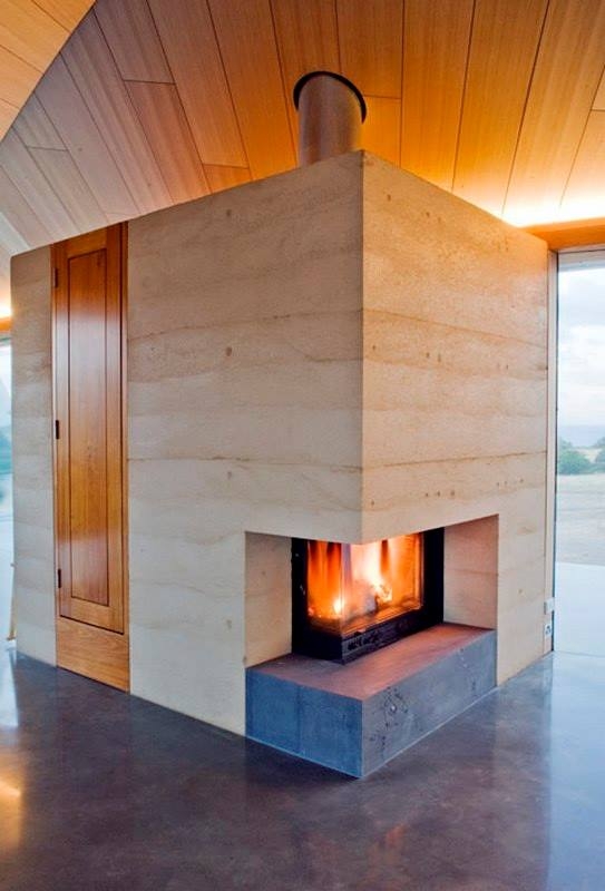 Rammed earth, timber and polished concrete. This is the work of Sydney based Architect, James Stockwell.
