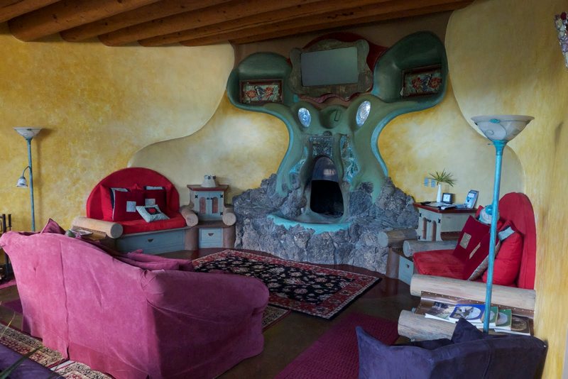 This fireplace is in an earthship living room.  What do you think of it?