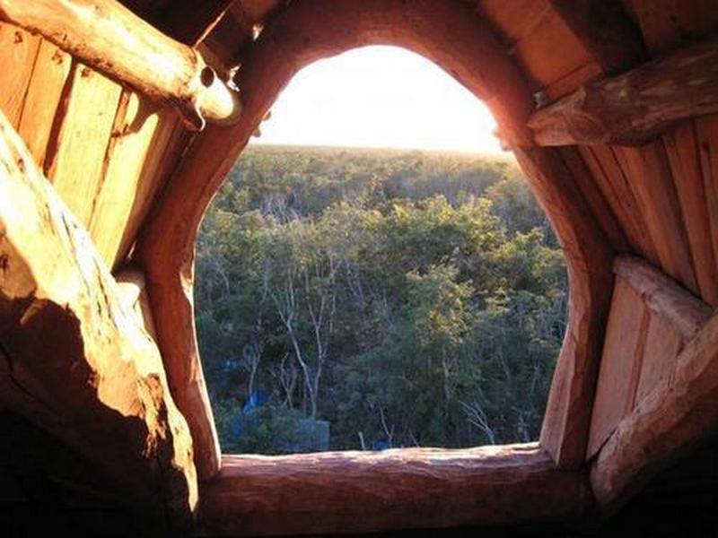 Is a window technically a window if it doesn't have any glazing?  I don't know, but I love the natural feel of this