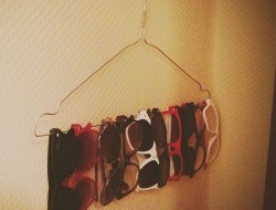 Use a wire hanger to store your sunglasses.