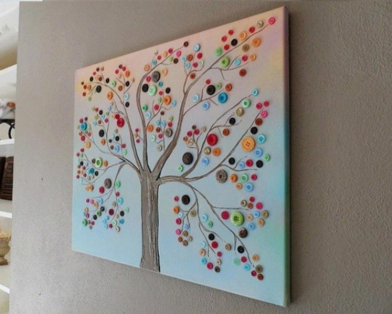 Why buy wall decor, when you can make one! Here's an idea that uses buttons. Thumbs up?