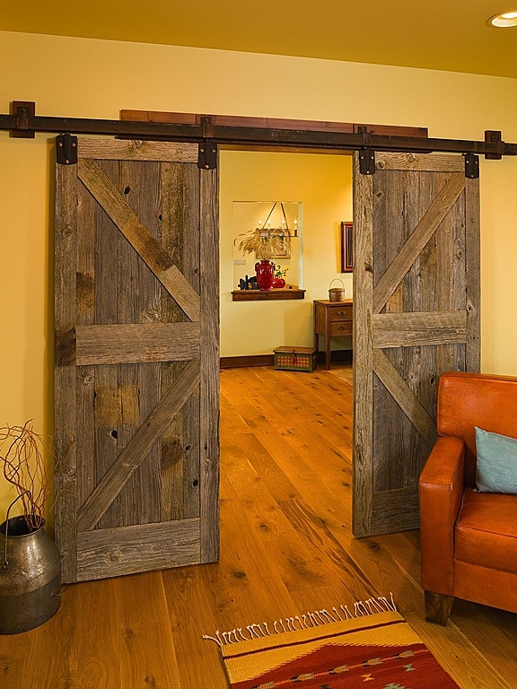 Barn doors are great solution for partitioning off areas when you are space limited. Could you use one in your home?