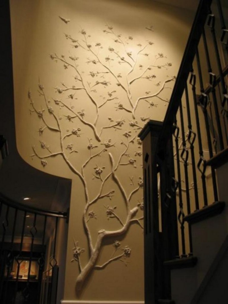 How's this for a unique feature wall.  It is simply made from tree branches attached to the wall and painted.