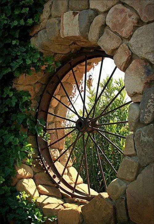 Have you ever thought of using an old wagon wheel for a window?