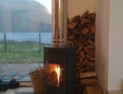 Leachachan Barn - a wood burning stove warms the full building
