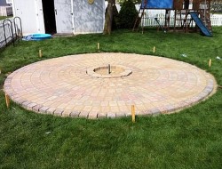 DIY Patio with Fire Pit - Brushing Pavers