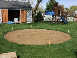 DIY Patio with Fire Pit - Putting Sand