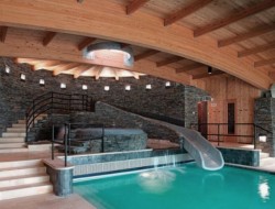 Indoor Pool Design with Cool Slide and Wooden Ceiling  - Remals