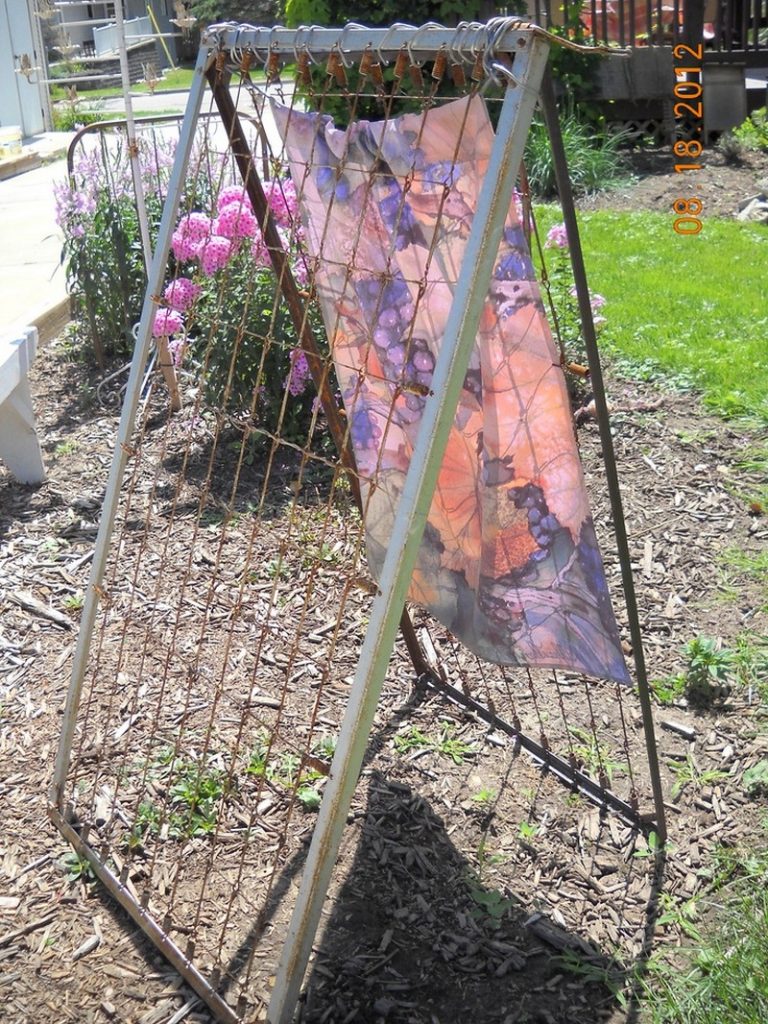 Trellis made from old spring bed.