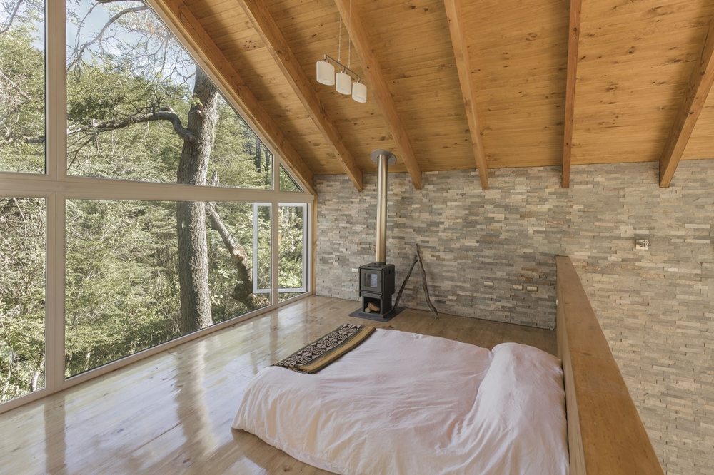 Two bedrooms provide stunning views of the outdoors.