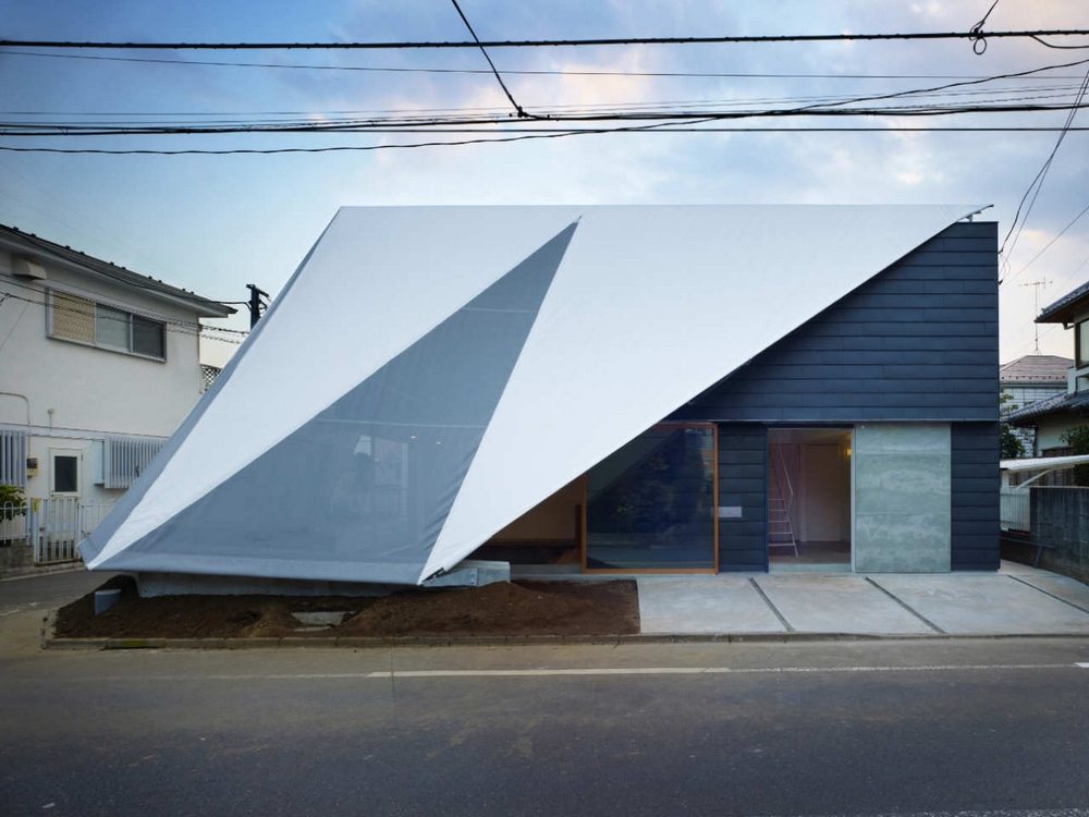 The tent structure serves as a wall, a roof, and a fence.