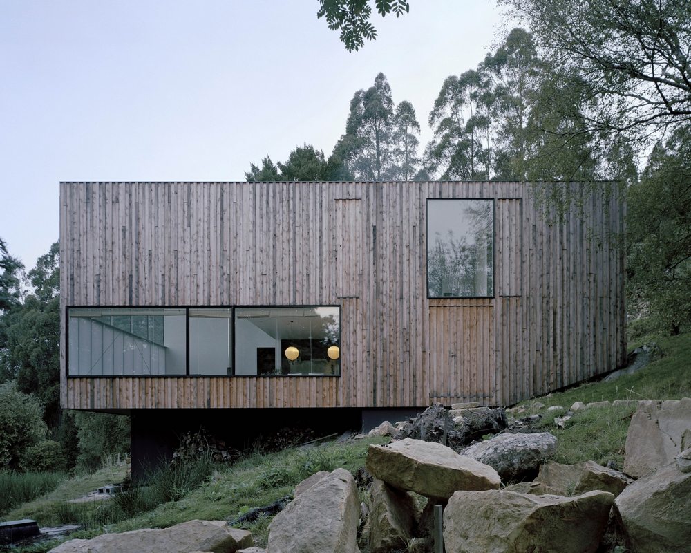 The house looks like a rectangular box with cut-out windows.