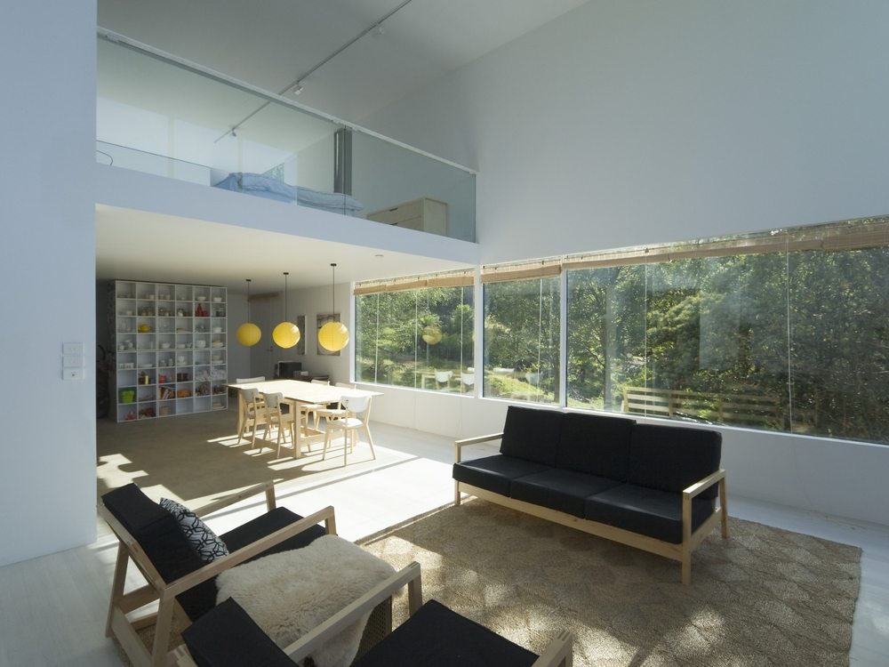 Strategically-placed windows open up the house to the surrounding landscape.