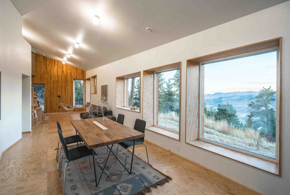 Large windows offer stunning views of the surrounding landscape.