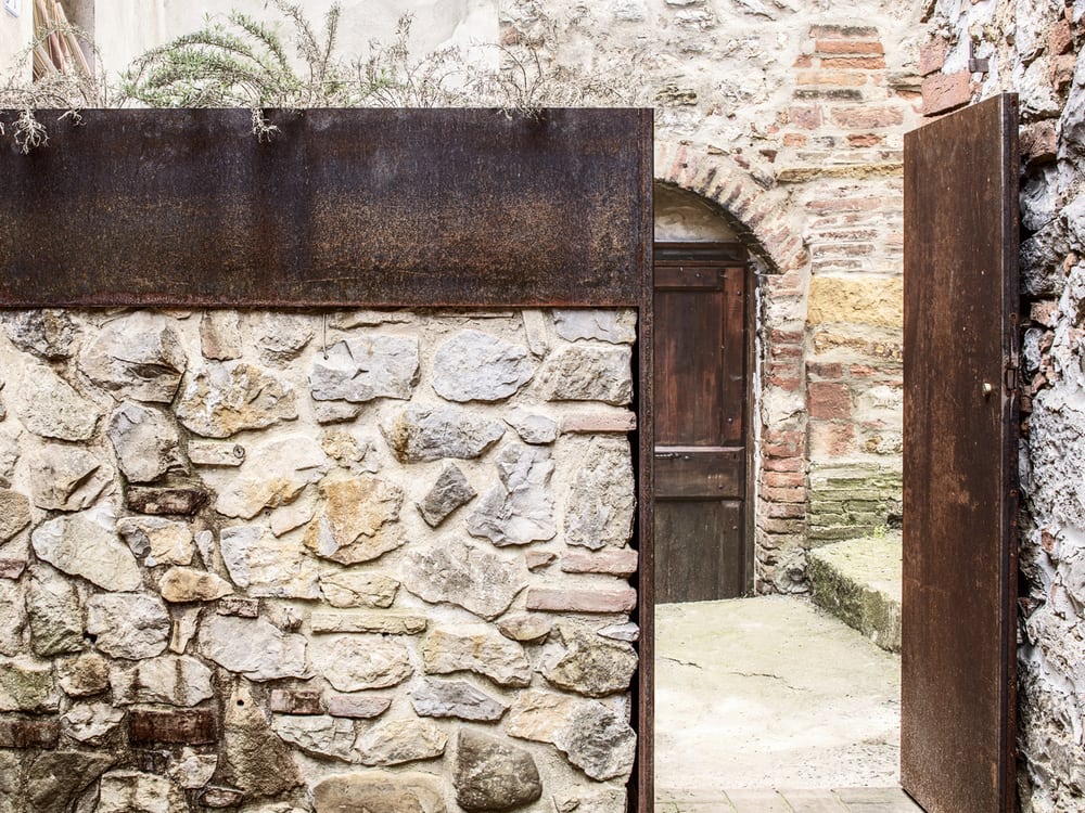 This obscure rusted steel gate leads into Effegi House.