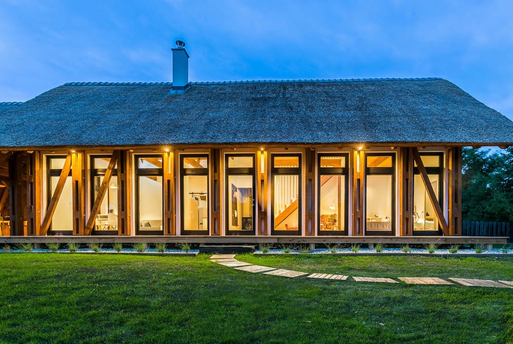 Large transparent windows and doors allow plenty of natural light into the home.