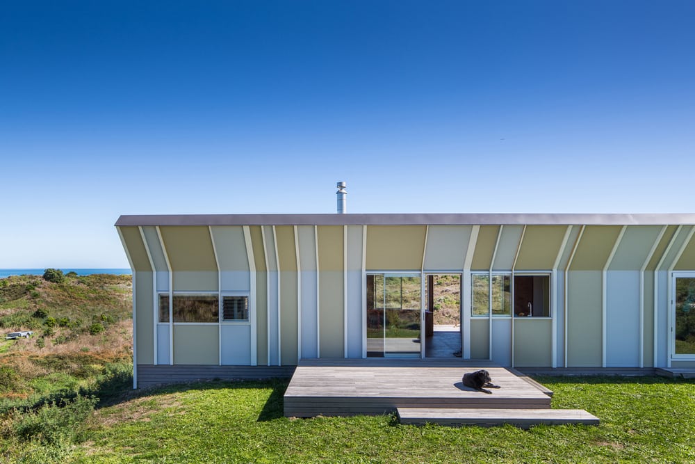 The neutral-colored facade allows the bach to blend well with the surrounding dunes.