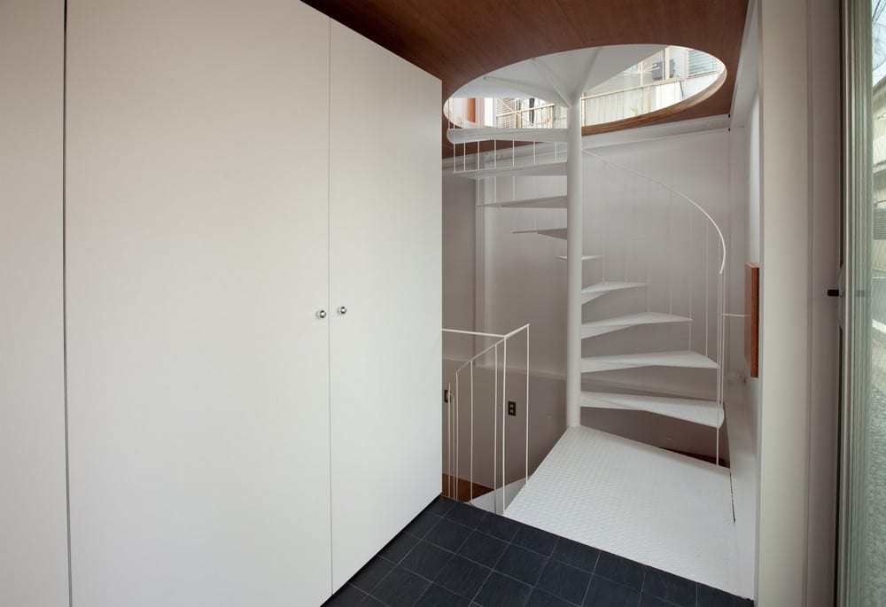 Like most houses, Small House offers an interesting focal point - this white spiral staircase.