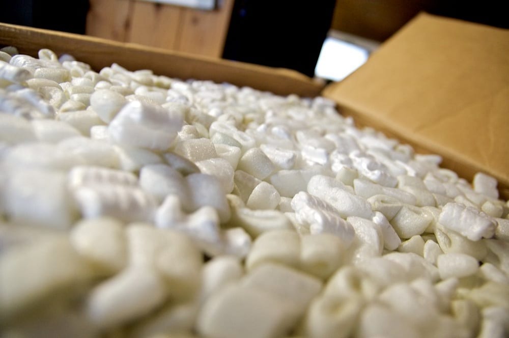 Filling the bottom half of large gardening pots and containers with packing peanuts saves you money