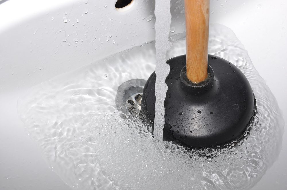 A bell-shaped plunger works best for both sink and tub drains