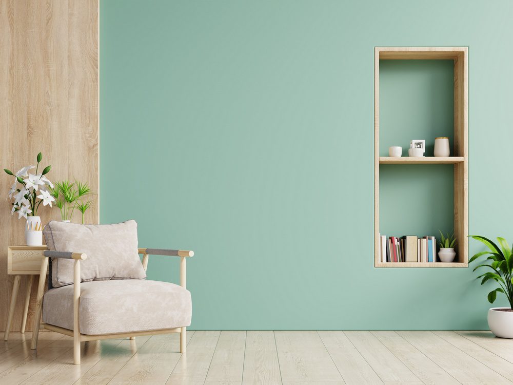 You might be able to solve a bare wall problem and a storage issue simultaneously by installing bookshelves on an empty wall in your home.
