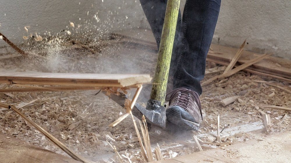 Dust and debris can be removed from the area with a broom, dustpan, and other tools.