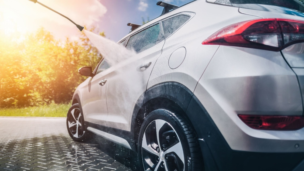 An image of car going through pressure washing.