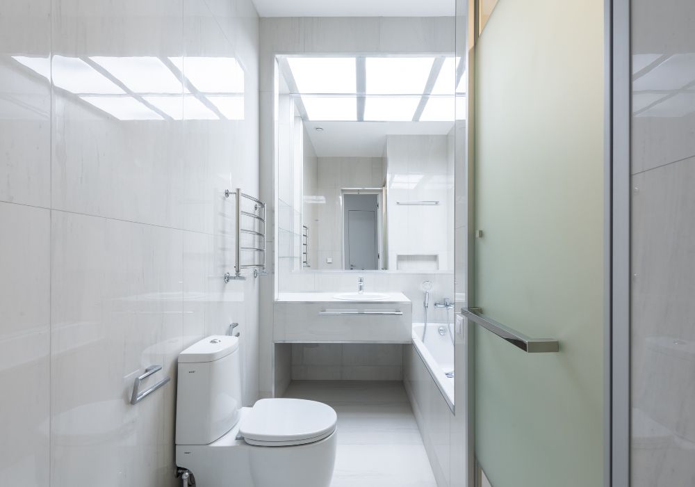 An image of a small bathroom using wall racks. 