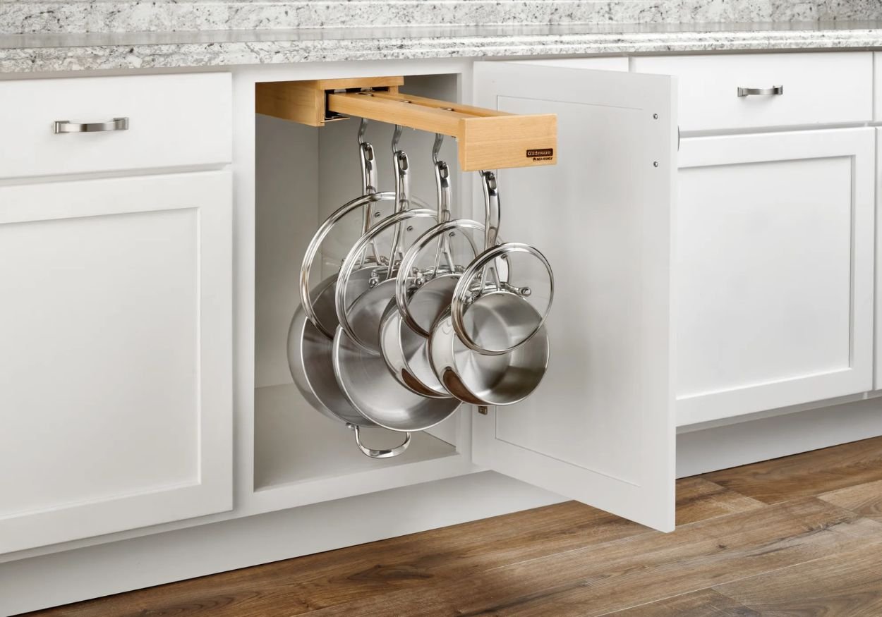 An image of the Glideware pull-out cabinet organizer for pots and pans holding pans and lids.