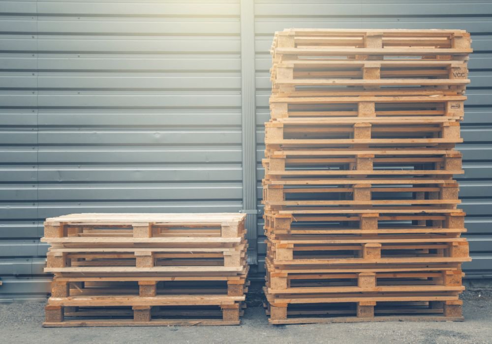 An image of stacked wooden pallets.